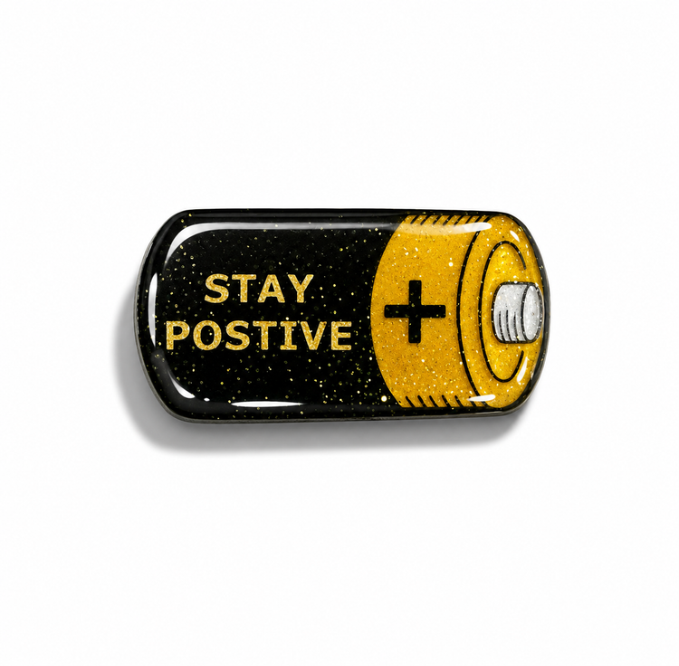 Battery-shaped pin with 'Stay Positive'