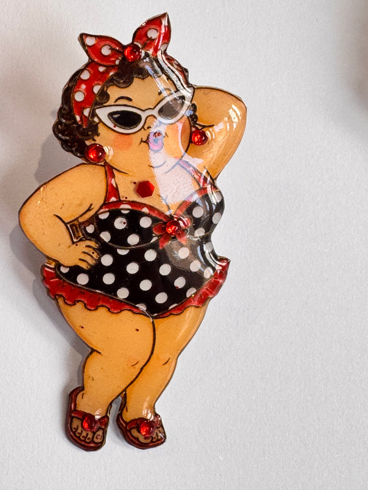 Chubby brown haired women in polka dot swimsuit brooch