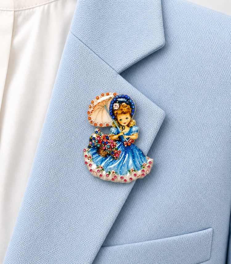 Decorative brooch of a girl holding flowers