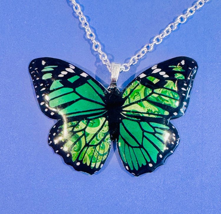 green butterfly handmade pendant made from tin cans
