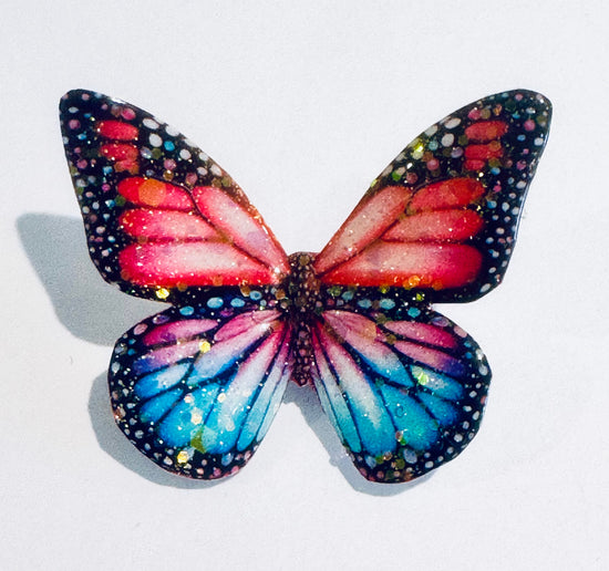 butterfly enamel pin made from soda cans