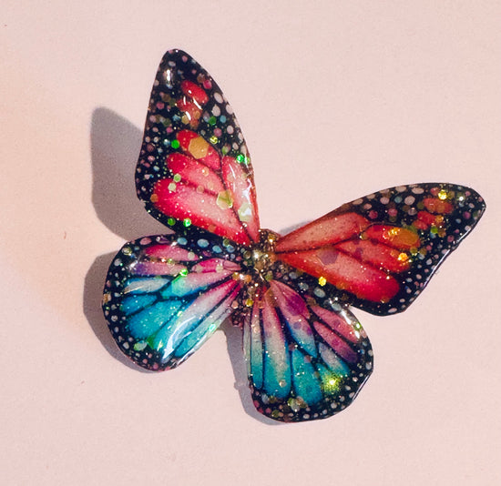 butterfly enamel pin made from tin drink cans