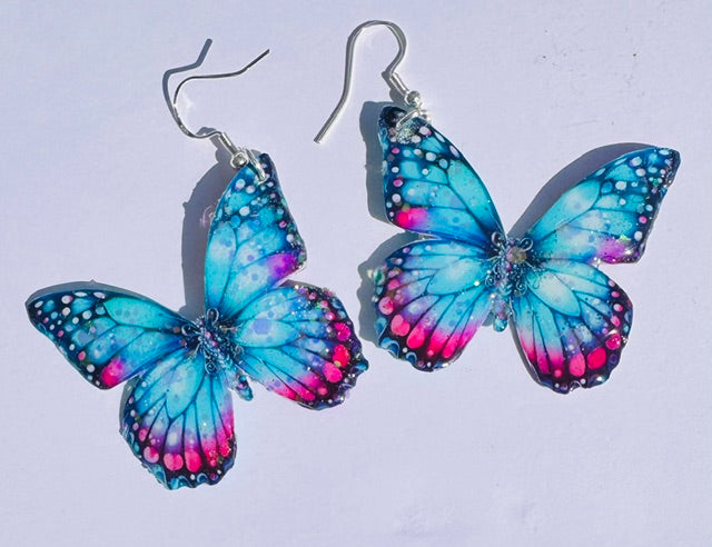 Turquoise and pink butterfly earrings.