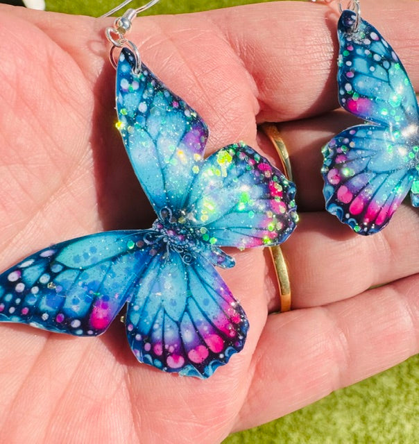 Turquoise and pink butterfly earrings. handmade from tin cans