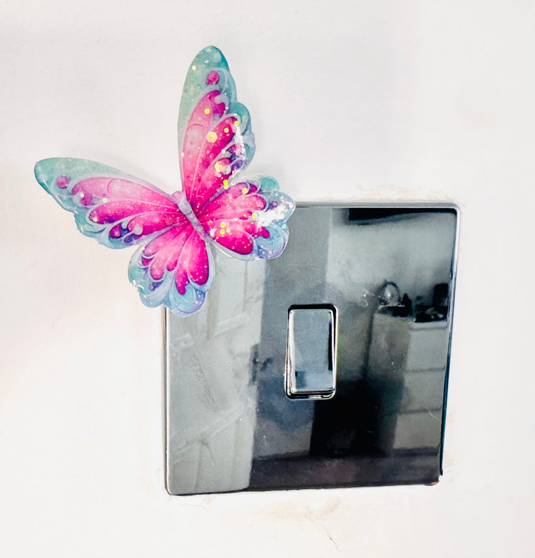 Decorative metal 3d butterfly sticker on a light switch
