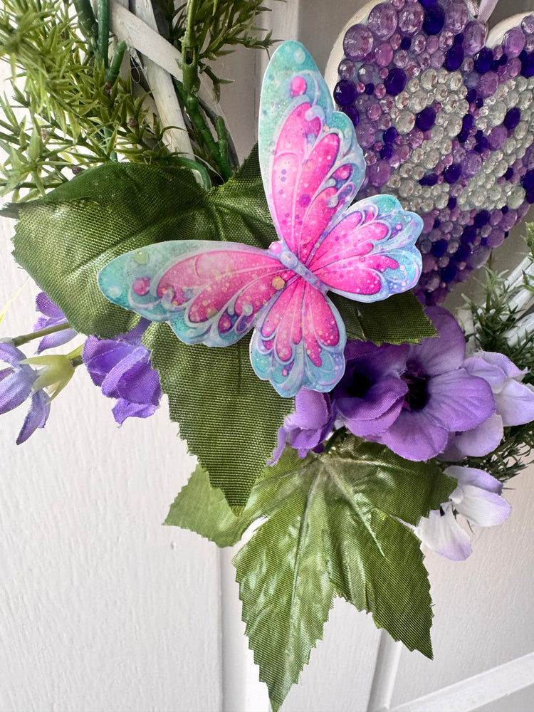 Bouquet with a colorful butterfly and purple flowers