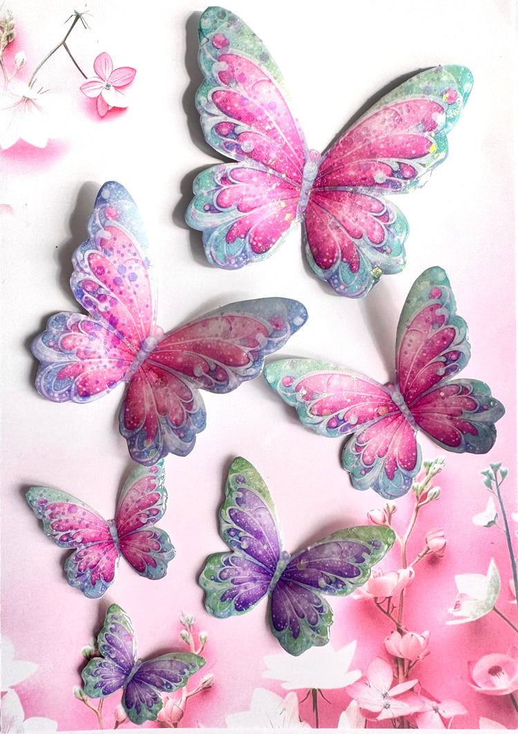 Colorful butterfly decorations on a pink floral background