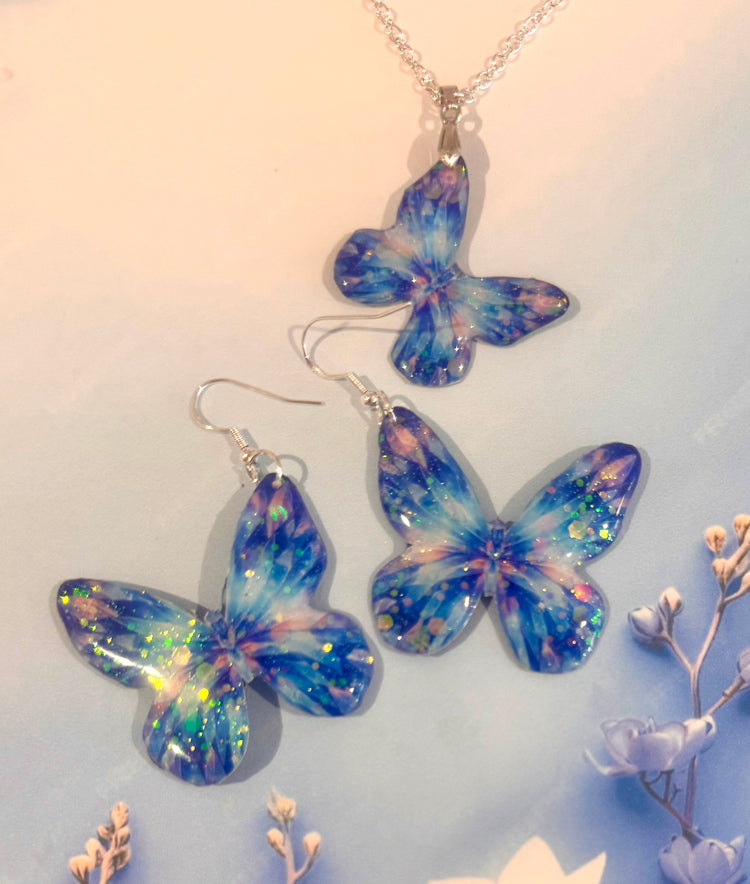 blue handmade butterfly earrings and pendant. Soda can art