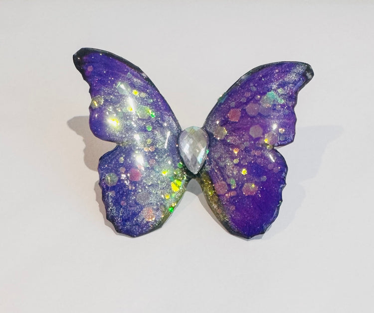 Purple diamante butterfly brooch.
