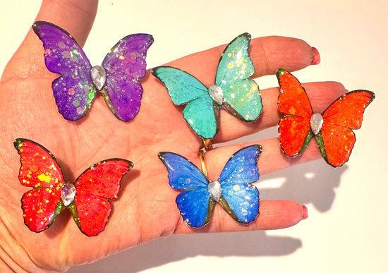 beautiful  butterfly brooches in many exciting colours. super shiny gift for her