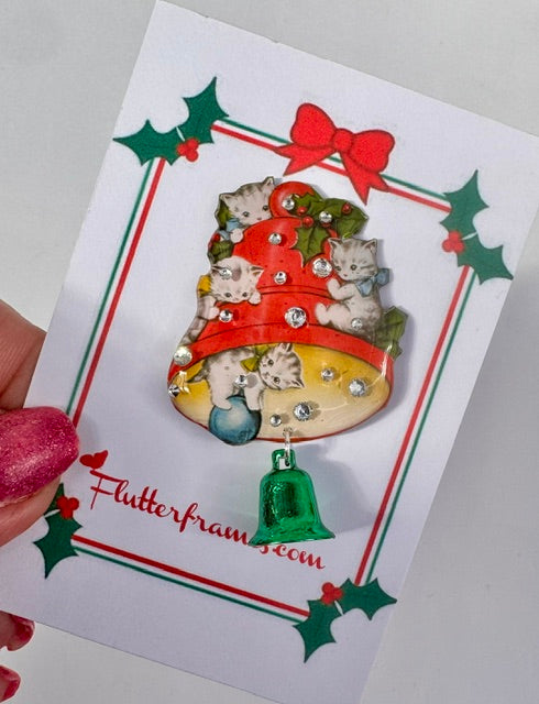 Retro Decorative brooch with cats on a Christmas tree design on a card with 'Flutterframes branding.