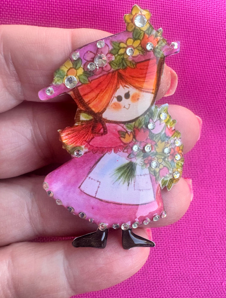 beautiful brooch made from recycled tin cans