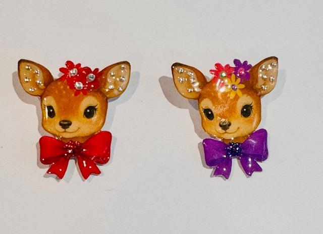 red and purple deer brooches