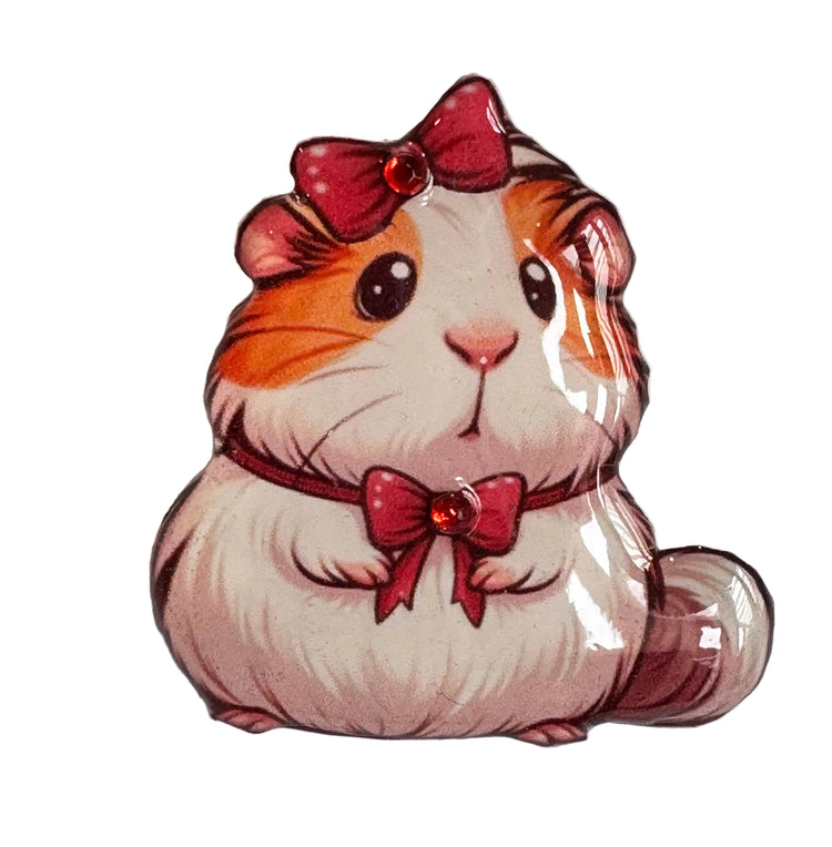 Illustration of a guinea pig with a red bow enamel pin