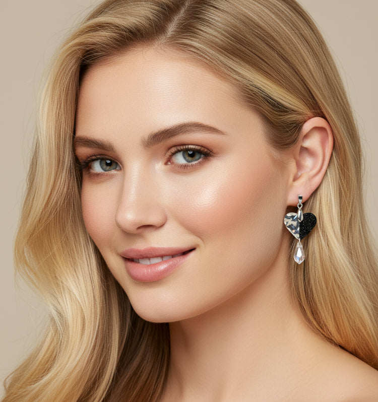 Heart-shaped earrings with clear and black heart design
