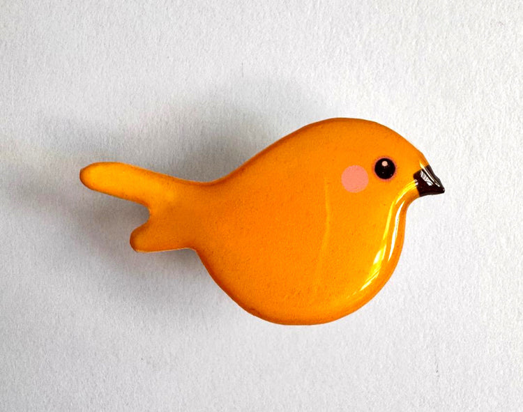 canary pin made from tin cans