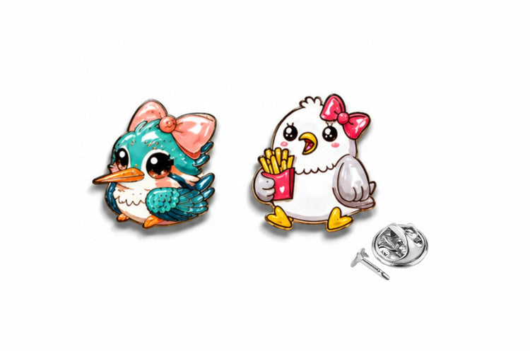 Two cartoon-style pins, one teal and one white with a chicken design