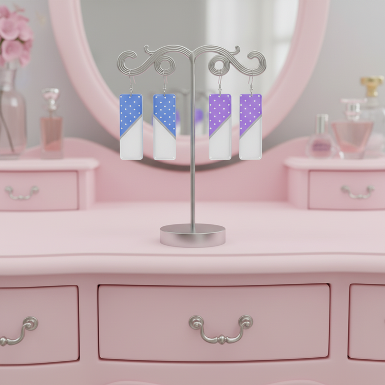 Earring display with colorful earrings on a pink vanity table