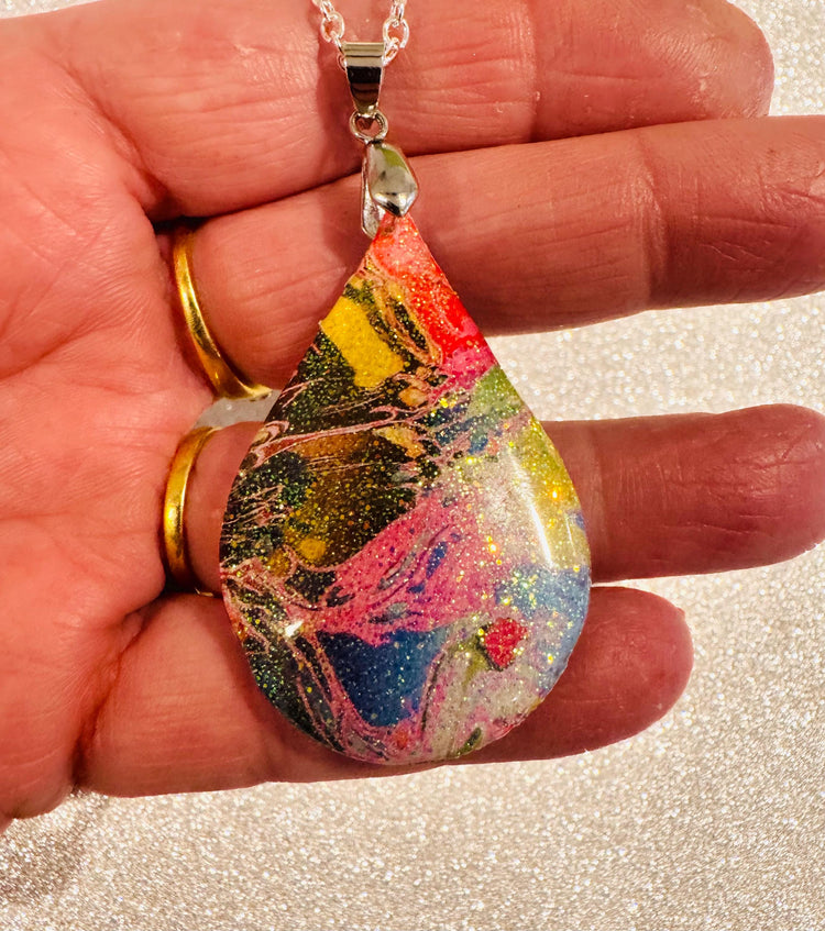 Brightly coloured abstract oval pendant.Upcycled tin can