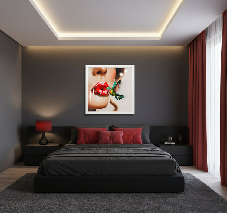 Framed artwork of a woman's face with red lips and a colorful Kingfisher bird