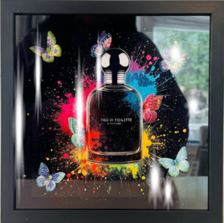 Glitzy perfume bottle with colorful butterflies and splashes