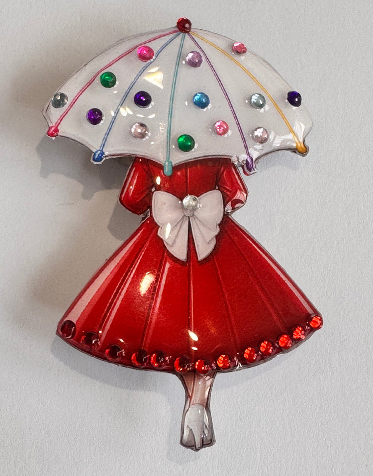 red and white brooch