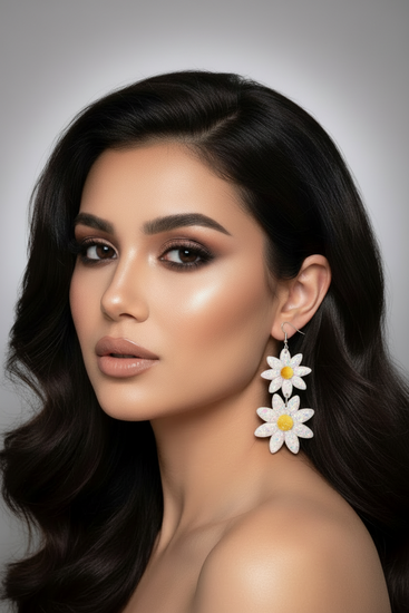 Woman wearing daisy flower earrings 