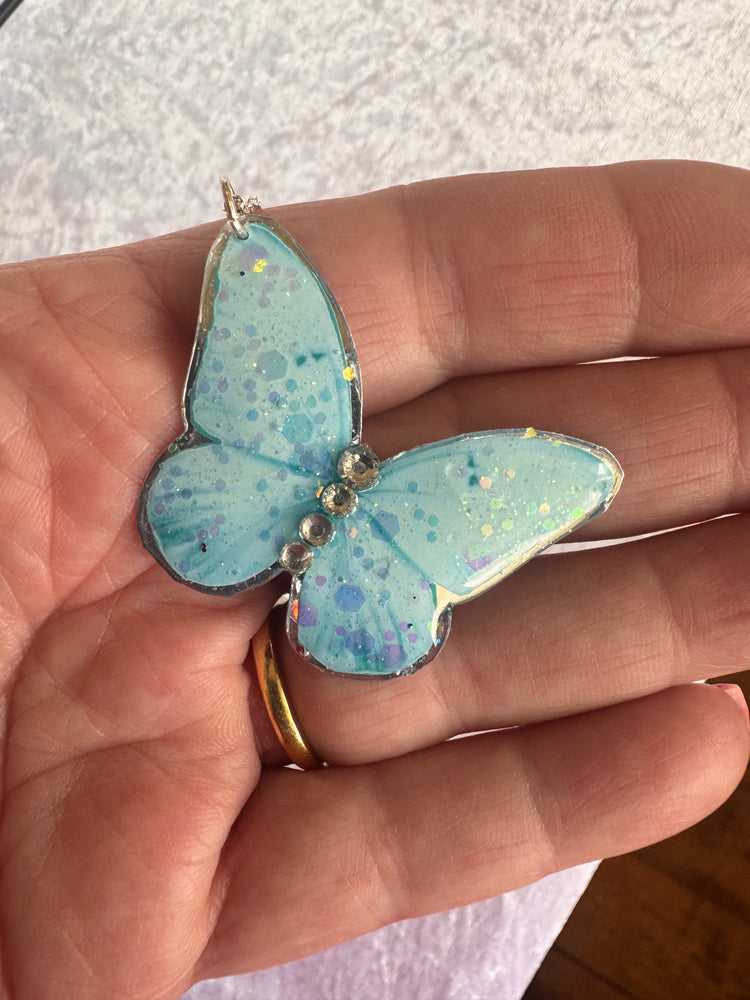 Blue butterfly pendant Made with tin cans 