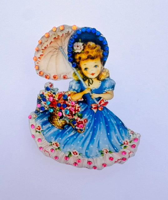 Vintage 1950's illustration of girl with bunch of flowers holding an umbrella Brooch