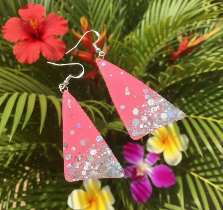 Pink triangle-shaped earrings made from recycled tin cans. Eco friendly