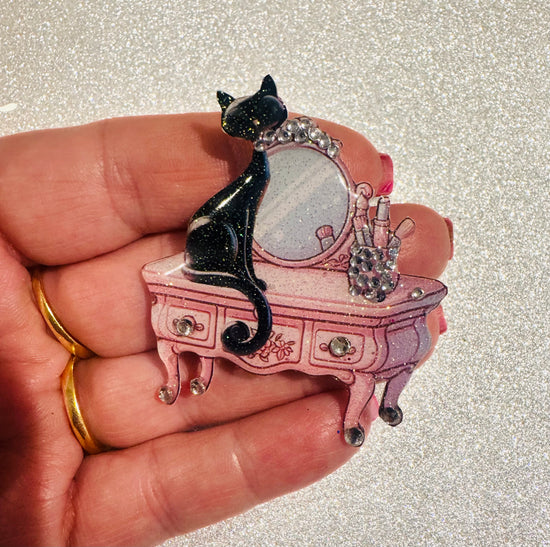 retro black cat on a pink dressing table brooch