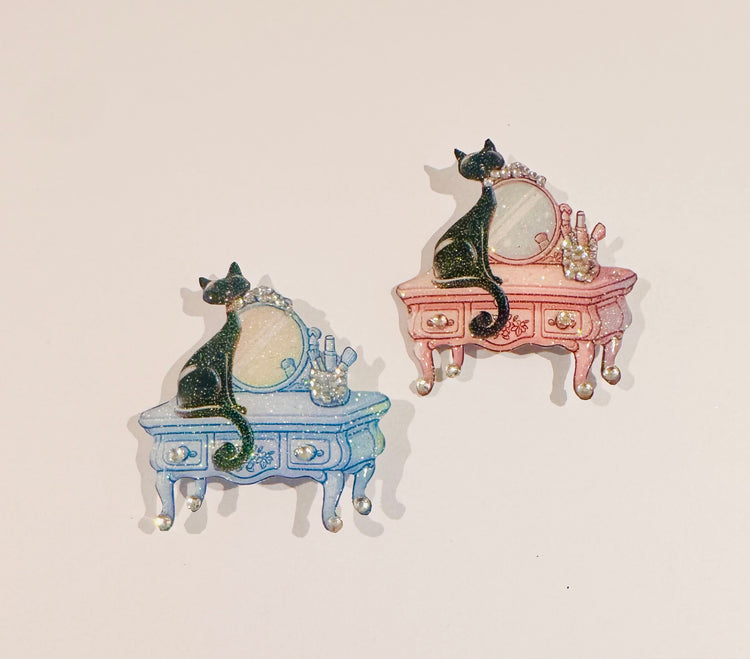 retro black cat on a pink or blue dressing table black cat