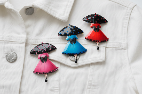 Colourful brooches of women with umbrellas 