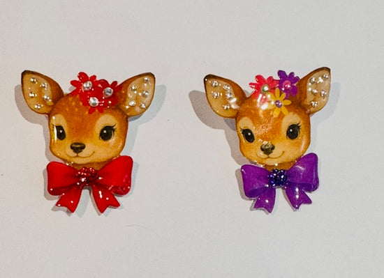 red and purple deer brooches