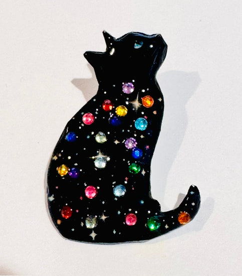 Lucky black diamante brooches