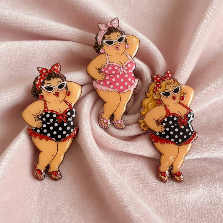 Three vintage-style bikini pin badges