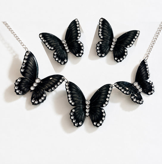 Black butterfly jewelry set featuring a statement necklace, matching earrings, decorated with small clear rhinestones 