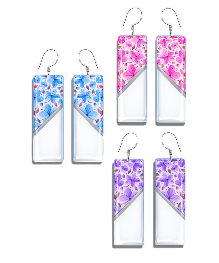 Floral long drop earrings. Handmade jewellery by Flutterframes. In lilac, pink and blue