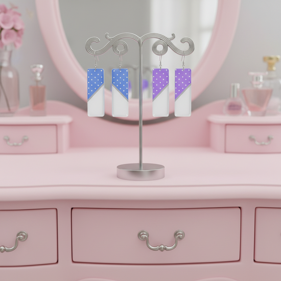 Earring display with colorful earrings on a pink vanity table