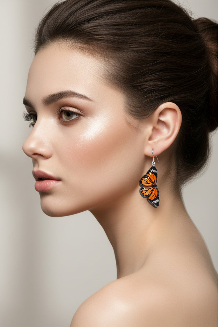Orange butterfly earrings handmade by Flutterframes