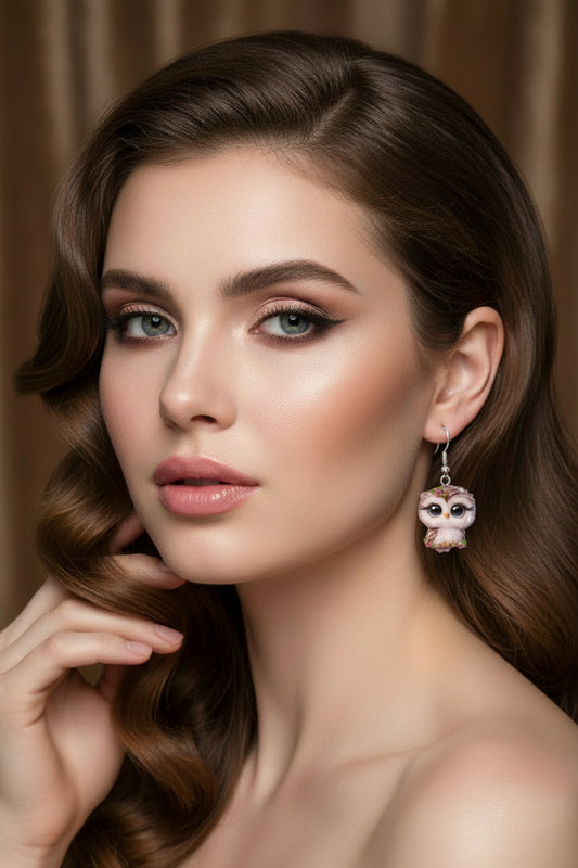 owl-shaped earrings with floral details