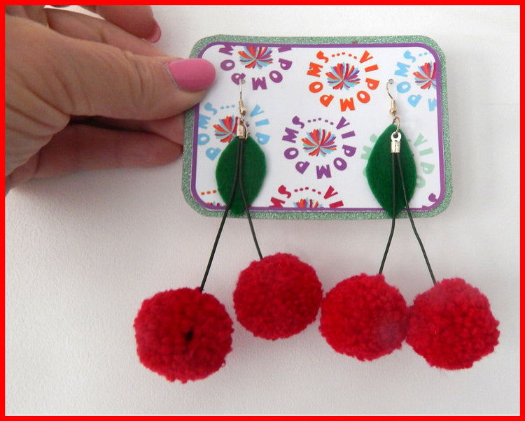 VIP pom pom earrings with a cherry on top