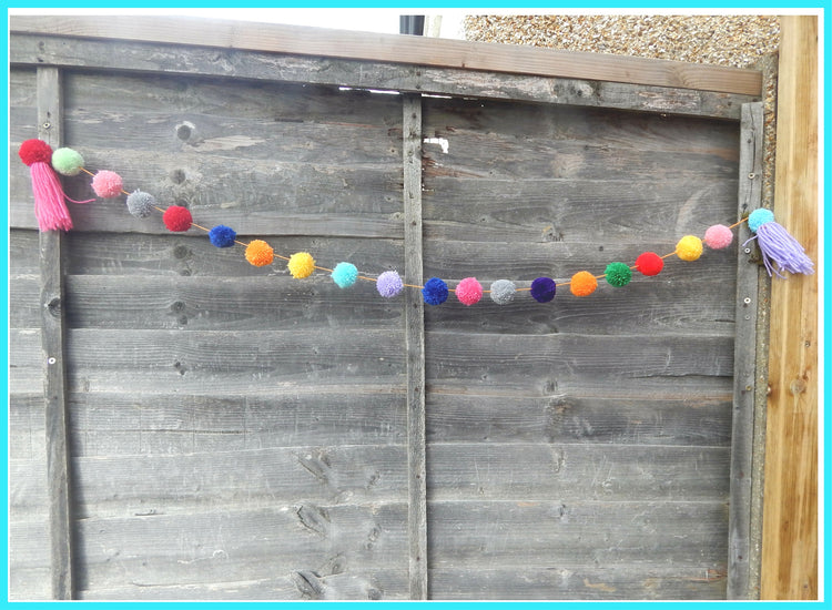 pom pom rainbow garland for outside parties