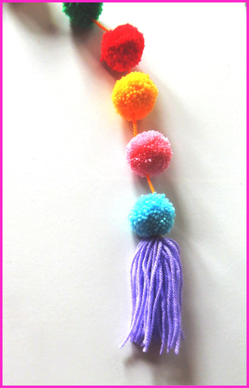 pom pom rainbow garland for outside parties