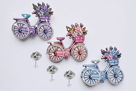  bicycle brooches with floral baskets 