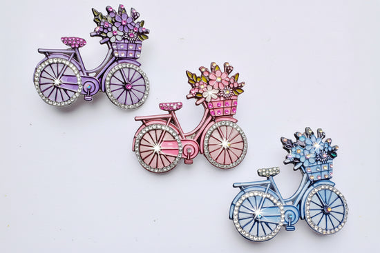 beautiful handmade diamante bicycle brooches/ pins in pink, lilac and blue