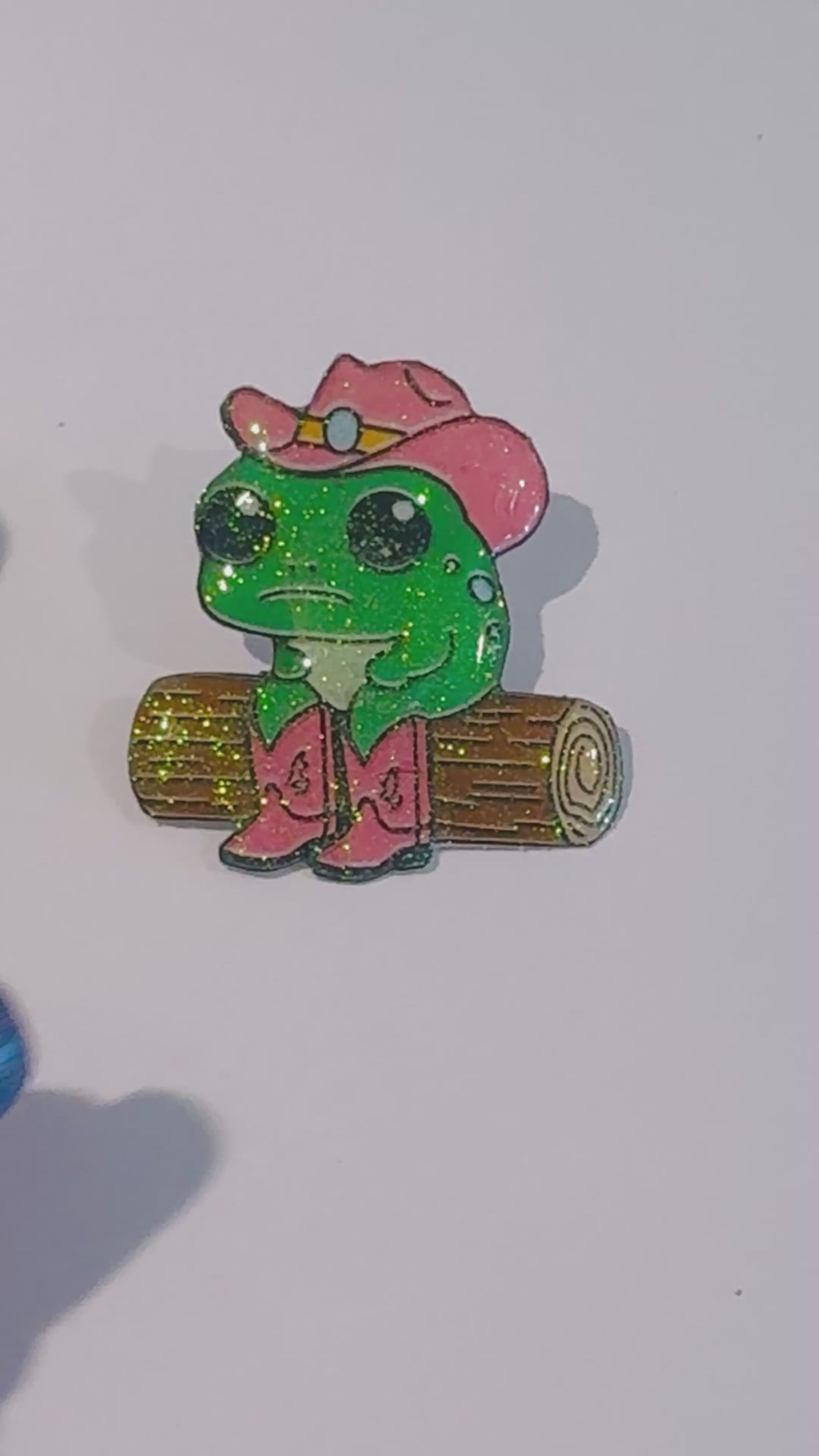 funny green frog. Line dancing. Enamel pin, magnet