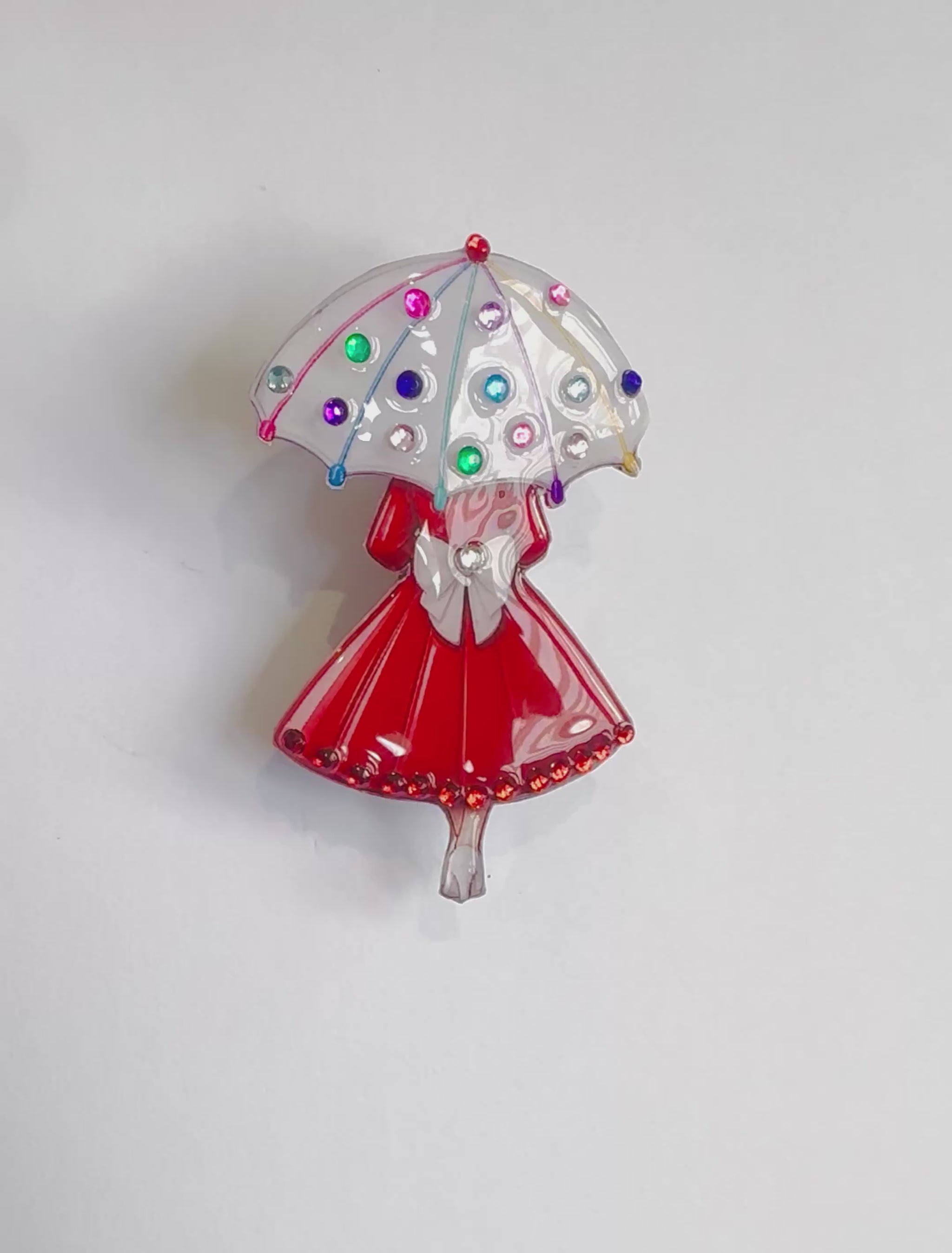 pretty vintage style, woman with umbrella red and white brooch
