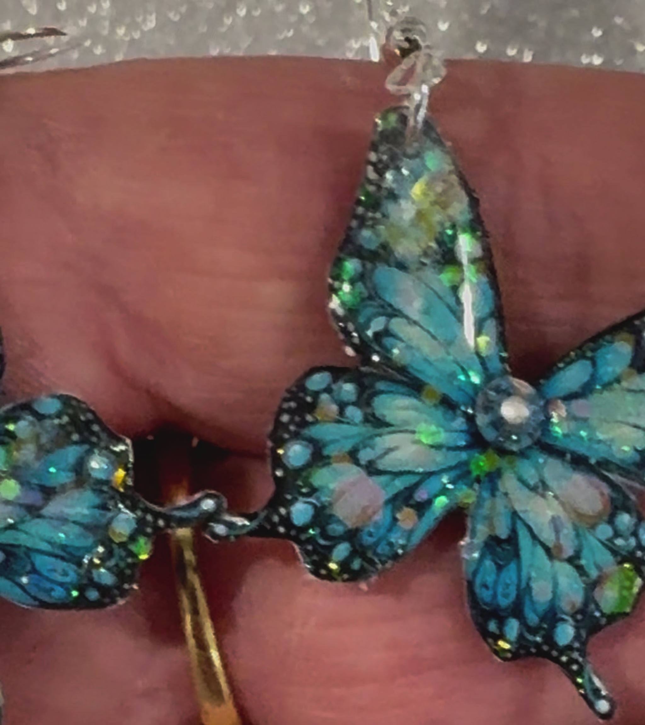 Butterfly earrings made from sida cans, unique to Flutterframes 