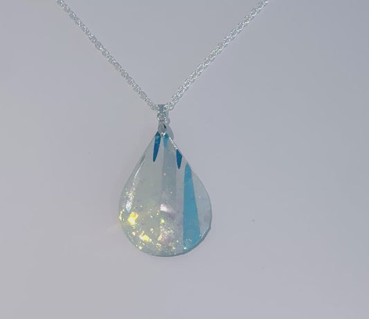 silver and blue oval abstract pendant, made from recycling